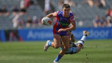 David Armstrong makes a break in Newcastle's 44-18 trial win over Cronulla in February. Picture by Marina Neil